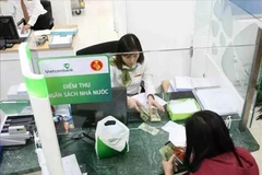 Vietnam’s state budget revenue reaches 574.4 trillion VND (22.5 billion USD) as of March 11. (Photo: VNA)