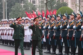 General Nguyen Tan Cuong (left), Chief of the General Staff of the Vietnam People’s Army, and Lieutenant General Saichay Kommasith, Deputy Minister of National Defence and Chief of General Staff of the Lao People's Army, review the Guard of Honor of the Vietnam People's Army at the welcome ceremony for the Lao official in Hanoi on March 5. (Photo: VNA)