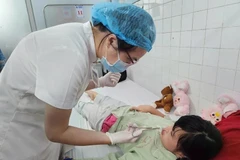 In Vietnam, approximately one in every 700–800 children is born with this condition. (Photo: VNA)