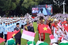 President of the Republic of Indonesia and Chairman of the Great Indonesia Movement Party (Gerindra) Prabowo Subianto (L) and Vietnamese Party General Secretary To Lam at the welcome ceremony in Jakarta on March 10. (Photo: VNA)