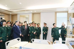 Party General Secretary To Lam and several key political figures visit the the Institute for Health Protection of Central Officials and the Clinical Institute for Infectious Diseases. (Photo: VNA)