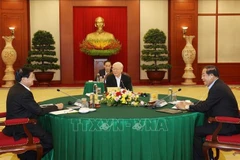 General Secretary Nguyen Phu Trong (C), President of the Cambodian People's Party Hun Sen (R) and Laos' Party General Secretary and President Thongloun Sisoulith at the Vietnam-Cambodia-Laos Summit in Hanoi, on September 26, 2021 (Photo: VNA)